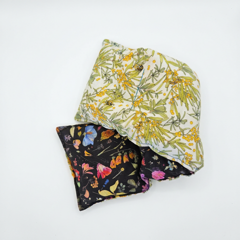 Black Floral and Wattle heat pack folded to show both patterns